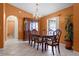 Elegant dining room featuring a wooden table, chandelier lighting, and a built-in china cabinet for storage at 2888 Middleton Cir, Kissimmee, FL 34743