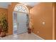 Welcoming foyer with tile flooring, transom window, and a neutral color scheme for a bright and airy entrance at 2888 Middleton Cir, Kissimmee, FL 34743