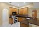 Kitchen features wooden cabinetry and granite countertops at 2888 Middleton Cir, Kissimmee, FL 34743