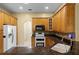 Kitchen featuring wooden cabinets and granite countertops at 2888 Middleton Cir, Kissimmee, FL 34743