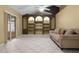 Bright living room showcasing built-in shelving, tiled floors, and sliding glass doors for easy access to the outdoors at 2888 Middleton Cir, Kissimmee, FL 34743