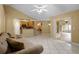 Open-concept living room featuring tile flooring and sliding glass doors to outdoor living space at 2888 Middleton Cir, Kissimmee, FL 34743