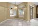 Versatile room with tiled floor, view to sun room, and sliding glass door to porch at 2888 Middleton Cir, Kissimmee, FL 34743