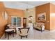 Bright living room with tile flooring, neutral furniture, and a sliding glass door leading to the outside at 2888 Middleton Cir, Kissimmee, FL 34743