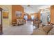 Spacious living room featuring tile floors, comfortable seating, and an open layout leading to the dining area at 2888 Middleton Cir, Kissimmee, FL 34743