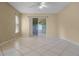 Open-concept living room with tile floors, recessed lighting, large windows, and sliding doors to the screened lanai at 2888 Middleton Cir, Kissimmee, FL 34743