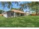 Expansive backyard featuring lush green grass and a well-maintained lawn, perfect for outdoor activities and relaxation at 3014 Linmont Ln, Eustis, FL 32726