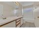 Bathroom featuring double sinks, a soaking tub with shower, and tiled floor at 3014 Linmont Ln, Eustis, FL 32726