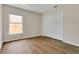 Comfortable bedroom with a double-door closet and a window at 3014 Linmont Ln, Eustis, FL 32726