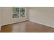 Bright bedroom featuring a window that views the exterior at 3014 Linmont Ln, Eustis, FL 32726