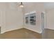 Light-filled dining area with hardwood floors and access to the backyard through sliding doors at 3014 Linmont Ln, Eustis, FL 32726