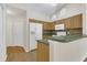 Bright kitchen featuring wood cabinets, white appliances, and tile backsplash at 3014 Linmont Ln, Eustis, FL 32726