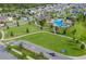 Aerial view of the playground, pool, clubhouse and recreation fields in the community at 3077 Nottel Dr, St Cloud, FL 34772