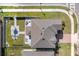 Aerial view of the property shows a well-manicured lawn and patio areas at 3077 Nottel Dr, St Cloud, FL 34772