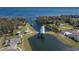 The community boat lift and lake access are surrounded by trees at 3077 Nottel Dr, St Cloud, FL 34772
