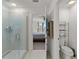 Bathroom with a tiled shower and views to the toilet area and bedroom at 3077 Nottel Dr, St Cloud, FL 34772