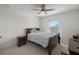 Bedroom featuring a window, carpet, neutral paint, and a ceiling fan at 3077 Nottel Dr, St Cloud, FL 34772