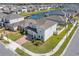 Beautiful home featuring well-maintained landscaping, a brick driveway and a view of the lake at 3077 Nottel Dr, St Cloud, FL 34772