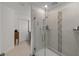 Shower with glass door, light tile, and built-in niche for toiletries at 3077 Nottel Dr, St Cloud, FL 34772
