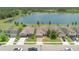 Aerial view of homes next to a picturesque lake in a peaceful residential neighborhood at 3953 Baja Dr, St Cloud, FL 34772