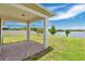 Paver patio looks out onto the lake view and spacious backyard with privacy fence at 3953 Baja Dr, St Cloud, FL 34772