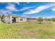 This backyard features lush grass, privacy fence and a view of the neighbor's yard at 3953 Baja Dr, St Cloud, FL 34772