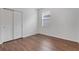 Bright bedroom features wood-look flooring, closet and a window for natural light at 3953 Baja Dr, St Cloud, FL 34772