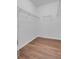 Walk-in closet featuring laminate wood flooring and metal shelving at 3953 Baja Dr, St Cloud, FL 34772