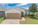 Charming single-story home with a two-car garage, brick accents, and well-maintained landscaping at 3953 Baja Dr, St Cloud, FL 34772