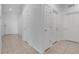 Hallway with access to various rooms, featuring tile flooring and neutral walls at 3953 Baja Dr, St Cloud, FL 34772