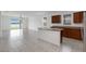 Open concept eat-in kitchen area with bar top seating, a view of the lake and sliding glass doors at 3953 Baja Dr, St Cloud, FL 34772