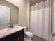 Cozy bathroom with new vanity, faucet, framed mirror, and shower with curtain at 5161 Kingwell Cir, Oviedo, FL 32765