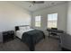 Serene bedroom with neutral carpet, ceiling fan and a view of the front yard at 5161 Kingwell Cir, Oviedo, FL 32765