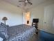 Bedroom features a queen size bed, tv and an attached bathroom at 5161 Kingwell Cir, Oviedo, FL 32765