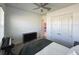 Bright bedroom featuring plush carpet, ceiling fan, a closet, and a keyboard at 5161 Kingwell Cir, Oviedo, FL 32765