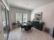 Bright breakfast nook with tiled floors and a sliding glass door to backyard at 5161 Kingwell Cir, Oviedo, FL 32765
