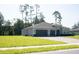 Attractive home with a three-car garage, well-kept lawn, and landscaping at 5161 Kingwell Cir, Oviedo, FL 32765