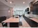 Open kitchen with white counters, dark cabinets, and stainless steel appliances at 5161 Kingwell Cir, Oviedo, FL 32765