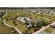 Community pool with palm trees, playground, and green space in residential neighborhood at 5291 Meredrew Ln, St Cloud, FL 34771