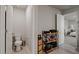 Functional bathroom with a toilet, vanity, and a door leading to the bedroom at 5291 Meredrew Ln, St Cloud, FL 34771
