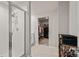Modern bathroom featuring a glass-enclosed shower and open access to a walk-in closet at 5291 Meredrew Ln, St Cloud, FL 34771