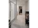 Well-lit bathroom featuring a glass-enclosed shower and walk-in closet access at 5291 Meredrew Ln, St Cloud, FL 34771