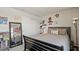 Comfortable bedroom with a gray quilted bedspread, decorated with posters and a full-length mirror at 5291 Meredrew Ln, St Cloud, FL 34771