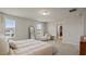 Inviting bedroom with natural light, cozy seating, and carpet at 5291 Meredrew Ln, St Cloud, FL 34771
