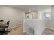Open upstairs landing providing access to bedrooms and staircase at 5291 Meredrew Ln, St Cloud, FL 34771