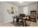 Functional home office with a modern desk, stylish decor, and ample natural light at 5291 Meredrew Ln, St Cloud, FL 34771