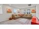 Comfortable living room featuring a sectional sofa, area rug, and natural light at 5291 Meredrew Ln, St Cloud, FL 34771