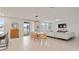 Open concept living room with dining area, lots of natural light and access to a patio at 5291 Meredrew Ln, St Cloud, FL 34771