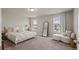 This main bedroom offers generous square footage, neutral decor, and two windows for natural light at 5291 Meredrew Ln, St Cloud, FL 34771