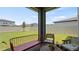 Cozy screened patio with comfortable seating, overlooking the fenced backyard at 5291 Meredrew Ln, St Cloud, FL 34771